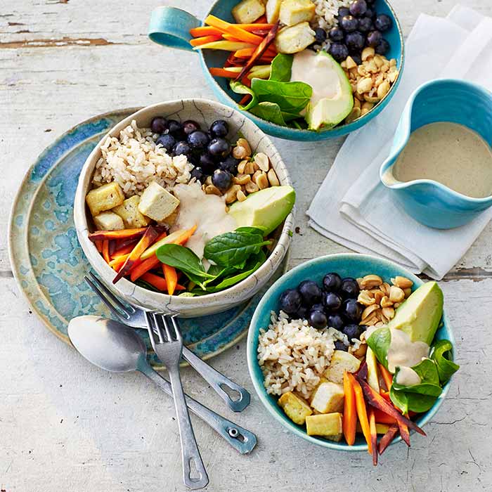Buddha bowls with tofu, rice and vegetables