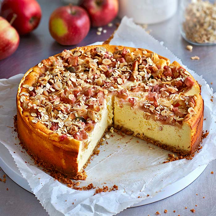 A vanilla quark cake with cranberries, apple and crunchy nut topping